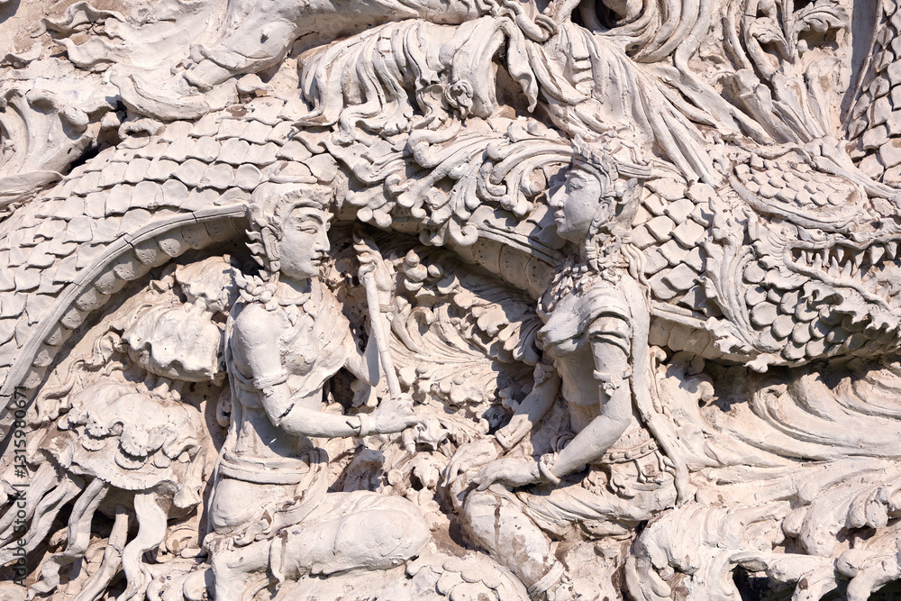 Traditional Thai stucco art at a temple in Thailand. Traditional Thai stucco art at a temple in Thailand.