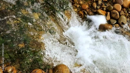 The beauty of a waterfall captured in cinematic slow-motion over rugged rocks