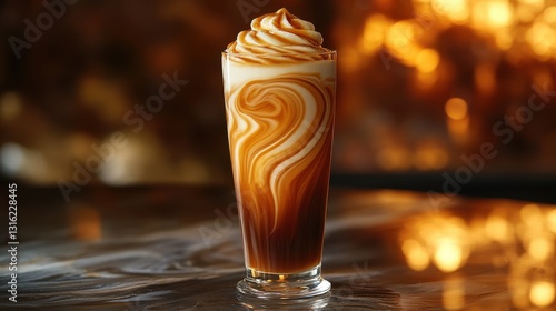 A tall, slender glass, filled with a vibrant coffee frappe, its surface smooth and reflecting the light. The base of the glass darkens towards the bottom, while swirls of caramel sauce cascade
