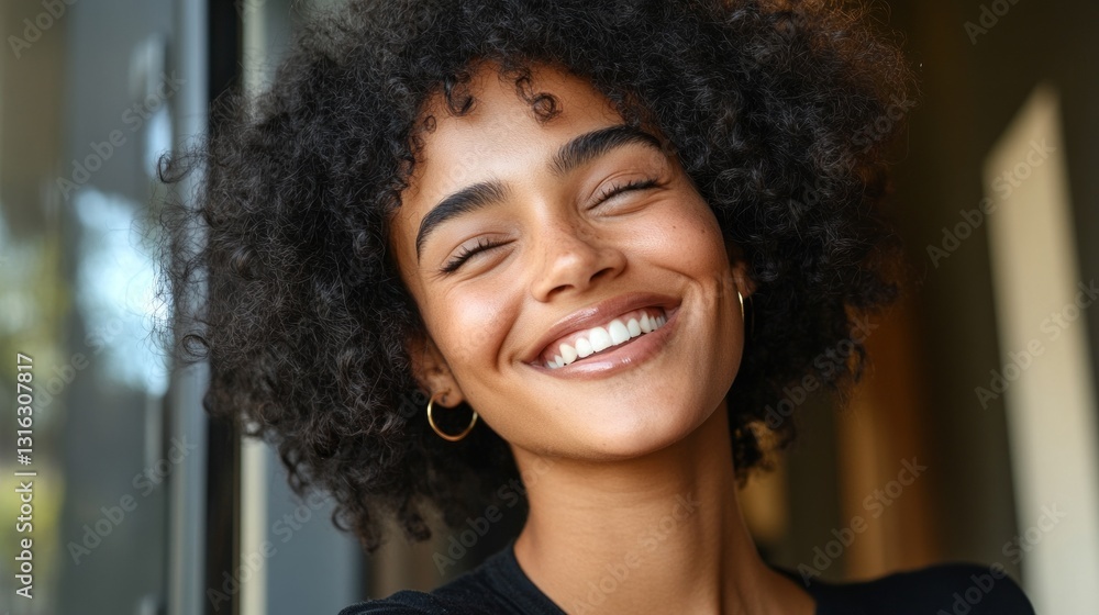custom made wallpaper toronto digitalWoman with short curly hair smiling at the camera.