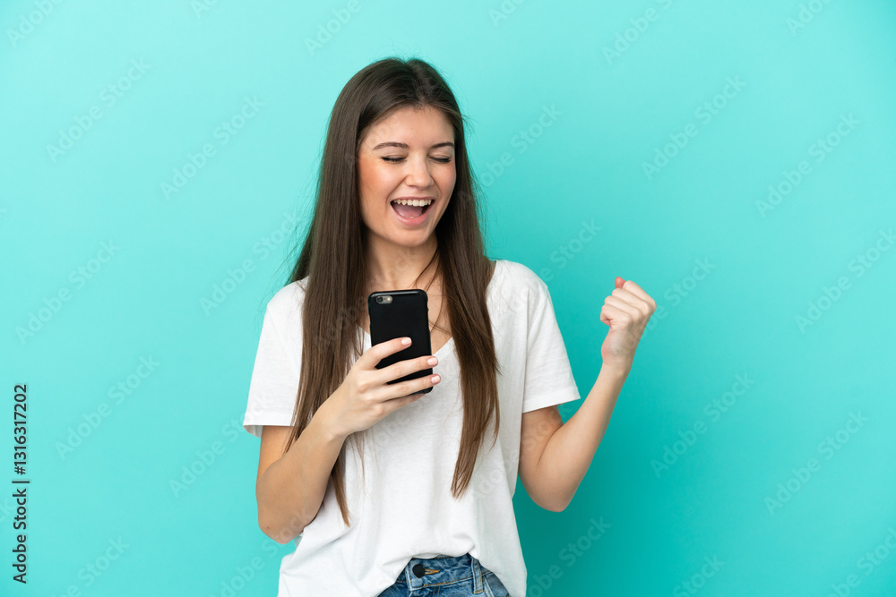 Young caucasian woman isolated on blue background with phone in victory position Young caucasian woman isolated on blue background with phone in victory position