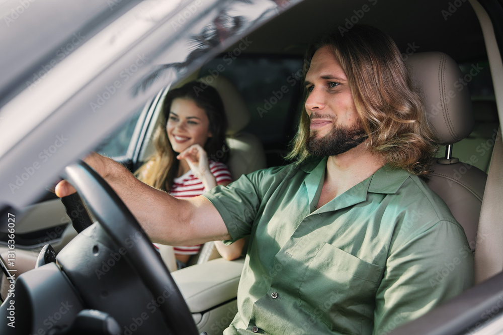 A man and a woman enjoying a drive in a car with a cheerful atmosphere The man is focused on the road while the woman smiles, creating a lighthearted vibe A man and a woman enjoying a drive in a car with a cheerful atmosphere The man is focused on the road while the woman smiles, creating a lighthearted vibe