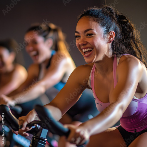 Women enjoying spin class.  Joyful fitness session