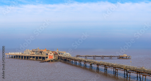 Wallpaper Mural Pier on the beach, early morning, calm sea, clouds, clear sky. Old ruined pier. Torontodigital.ca