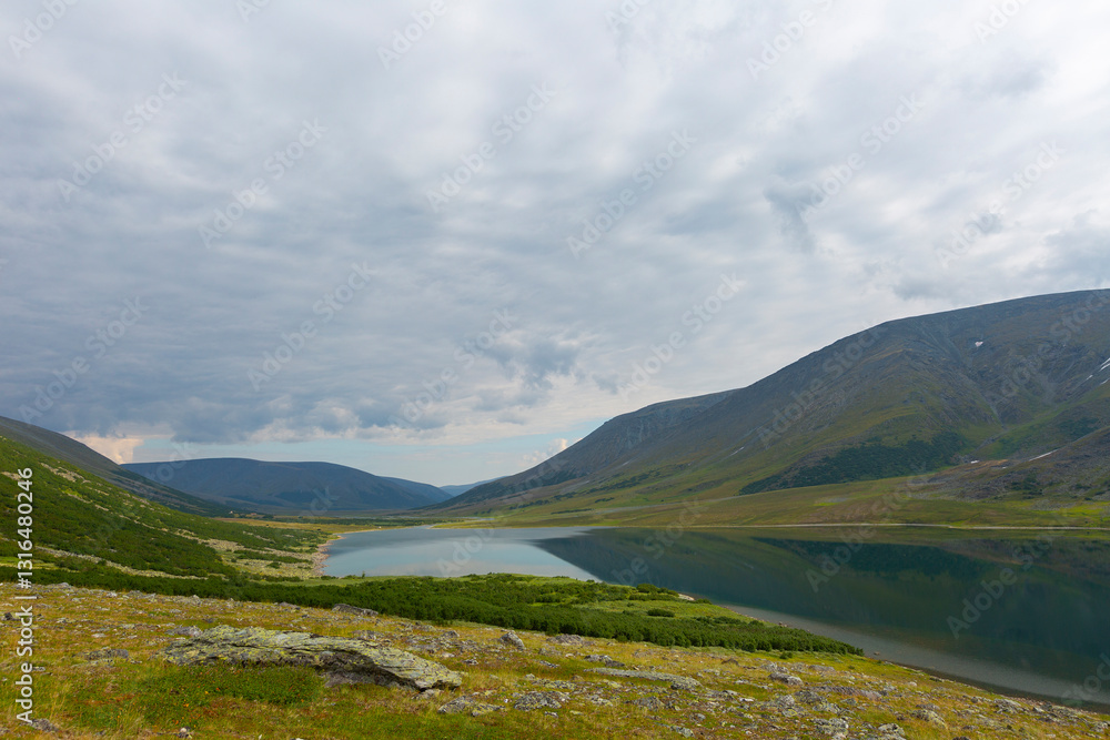 Summer day landscape with mountains and lake in the tundra, Yamal, Russia