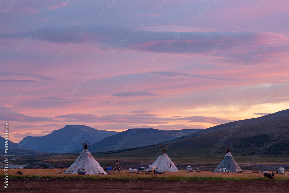 Landscape at sunrise, dwellings of nomads and mountains, Russia, Yamal