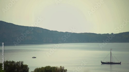 Greek trireme ancient rowed warship at calm blue sea