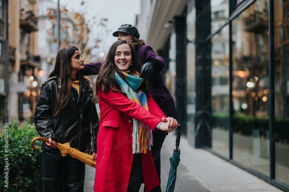 Obraz premium Three women dressed stylishly, walking in an urban setting, sharing joyful moments and enjoying their time together outdoors amidst city architecture and autumn vibes.