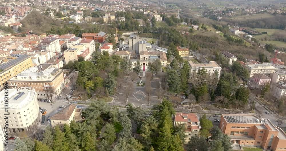 Aerial view of the Emiciclo Palace, also known as the Exposition Palace. It is a monumental complex in L' Aquila, Italy, seat of the Regional Council of Abruzzo. Aerial view of the Emiciclo Palace, also known as the Exposition Palace. It is a monumental complex in L' Aquila, Italy, seat of the Regional Council of Abruzzo.