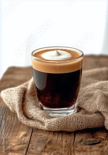 Coffee Drink Topped With Whipped Cream Served in a Glass on a Wooden Surface