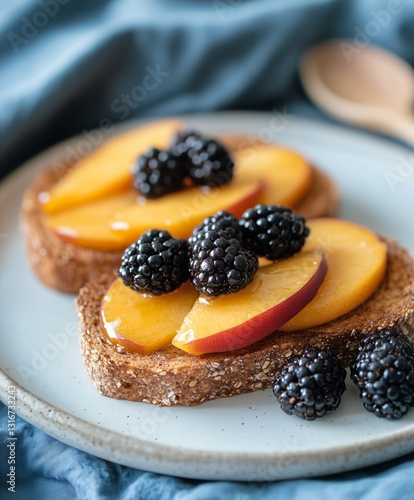 Freshly Prepared Toast Topped With Juicy Peaches and Blackberries on a Rustic...