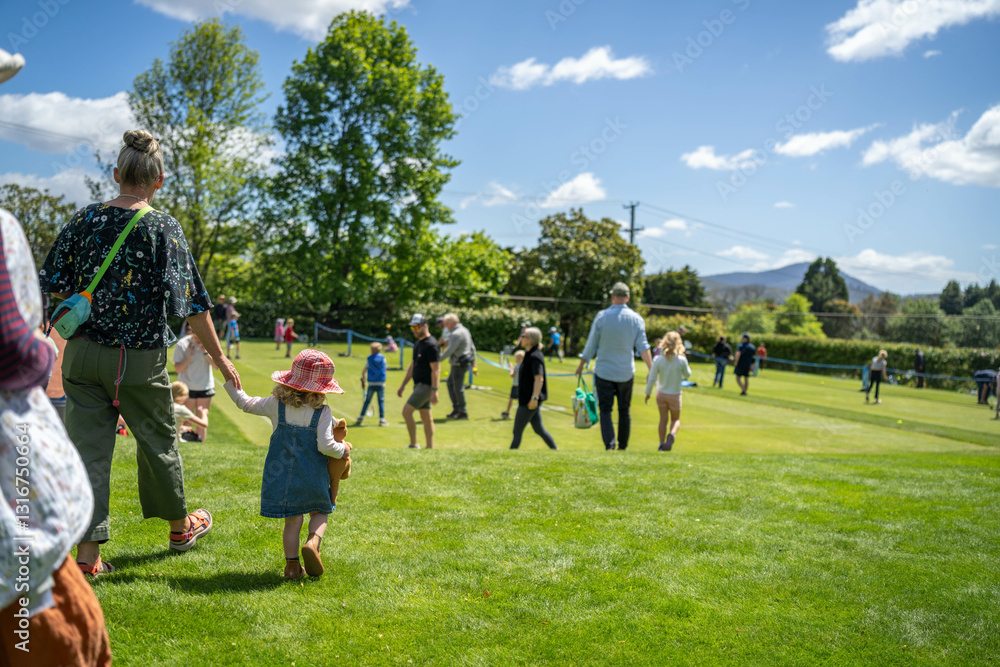 Obraz premium children play grass tennis in a lawn tennis court learning and having fun