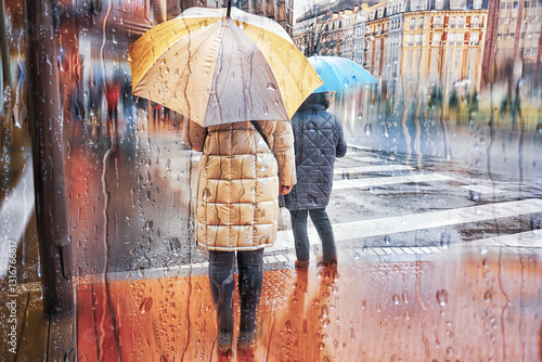 Wallpaper Mural Pedestrian on the street with an umbrella in rainy days in winter season Torontodigital.ca