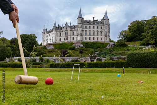 Dunrobin Castle, fairy-tale gem overlooking North Sea, offers breathtaking gardens, exquisite summer blooms. A masterpiece of elegance, lush landscapes meet historic charm, unfold on manicured lawns photo
