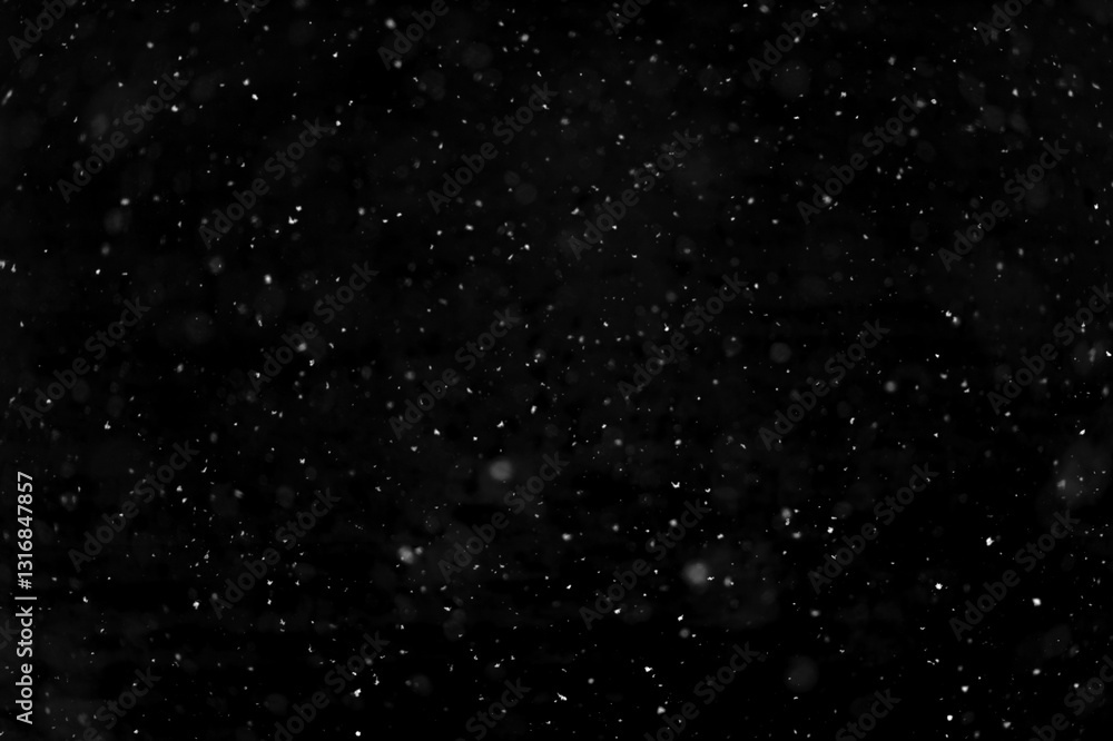 Fototapeta premium Texture of natural falling snow on black background.
