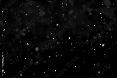 Texture of natural falling snow on black background.