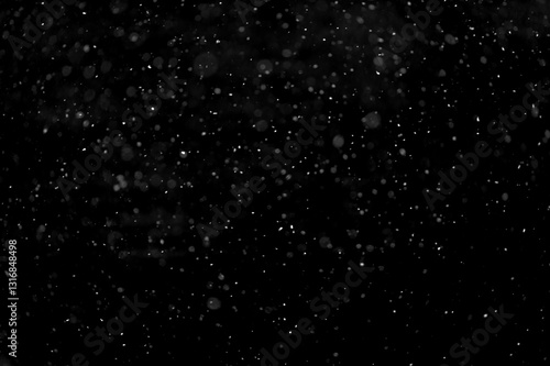 Texture of natural falling snow on black background.