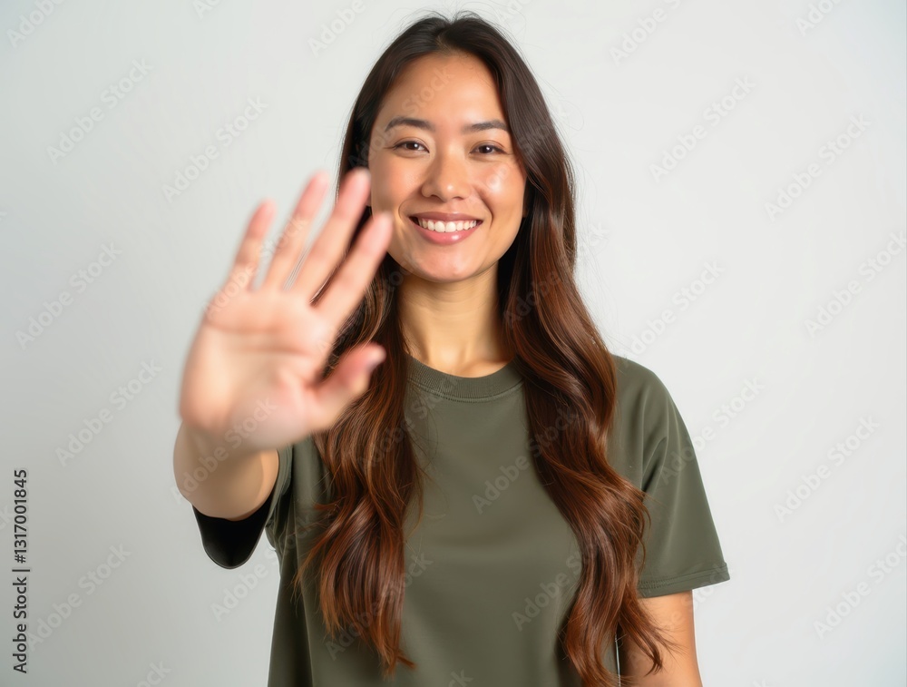 Smiling woman showing stop sign with hand on white background Smiling woman showing stop sign with hand on white background