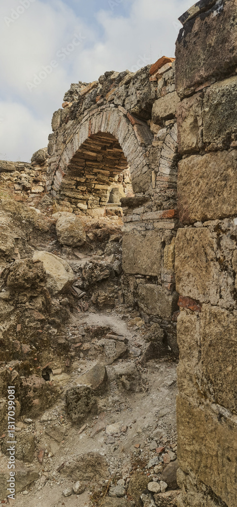 Fototapeta premium Old ruins with arc vertical photography