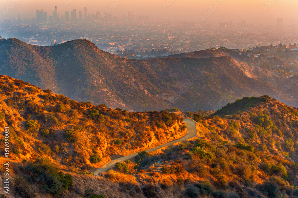 Fototapeta premium Winding Hiking Trails at Griffith Park Overlooking Hazy Downtown Los Angeles