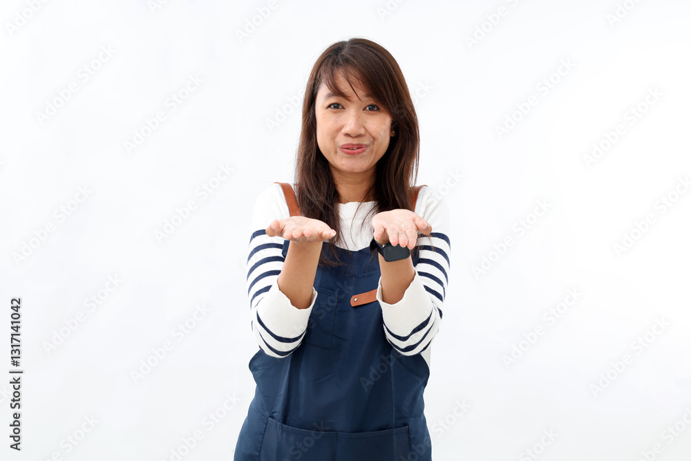 Young asian bartender woman wearing apron showing his empty palm to the front, holding something isolated on white background Young asian bartender woman wearing apron showing his empty palm to the front, holding something isolated on white background