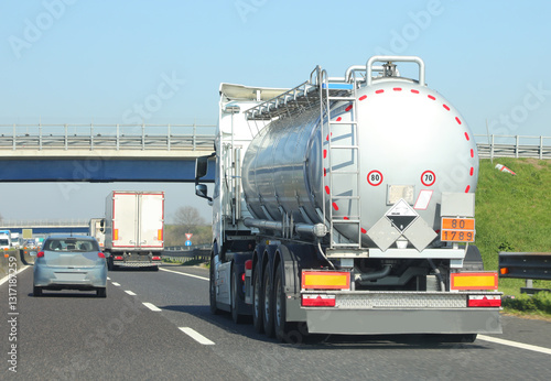 Fuel tanker truck speeding on the highway to resupply gas stations