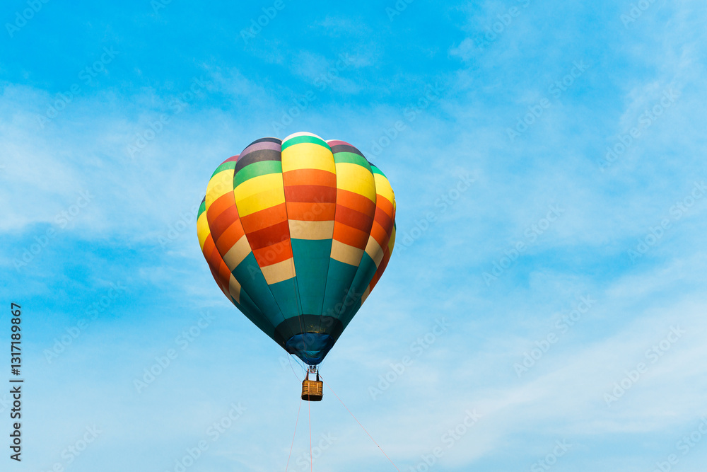 Naklejka premium Colorful hot air balloon floating in blue sky