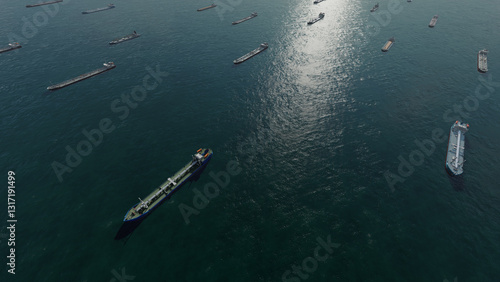 Oil tankers in sea. Nautical bulk carrier ships. Crude oil tankers ships, a merchant vessels specially designed for chemical products transportation. Aerial view. Global shipping. Logistic Transport. 