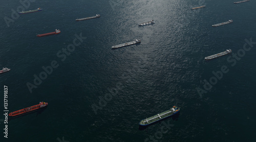 Aerial view, Oil tankers and gas ships waiting in the bay. Waiting to unload oil load from pipeline in the sea to wait for onward transportation. Commercial ships at sea. Large commercial cargo ships 
