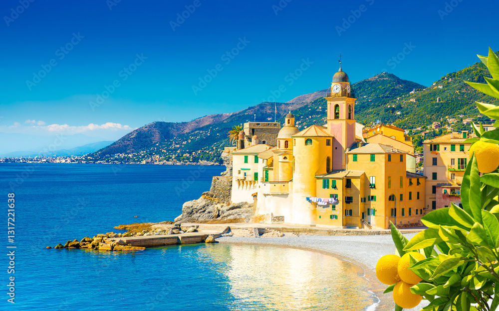 Scenic Mediterranean riviera coast. Panoramic view of Camogli town in Liguria, Italy. Basilica of Santa Maria Assunta and colorful palaces. Liguria, Italy
