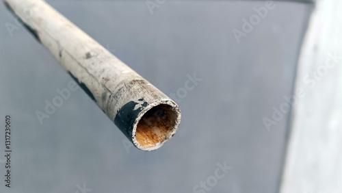 The end of the white pipe that releases water