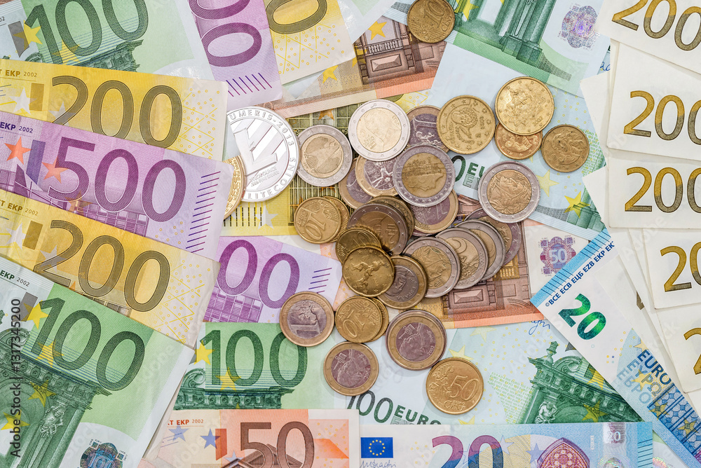 pile of European currency paper euro banknotes with metal coin, top view pile of European currency paper euro banknotes with metal coin, top view