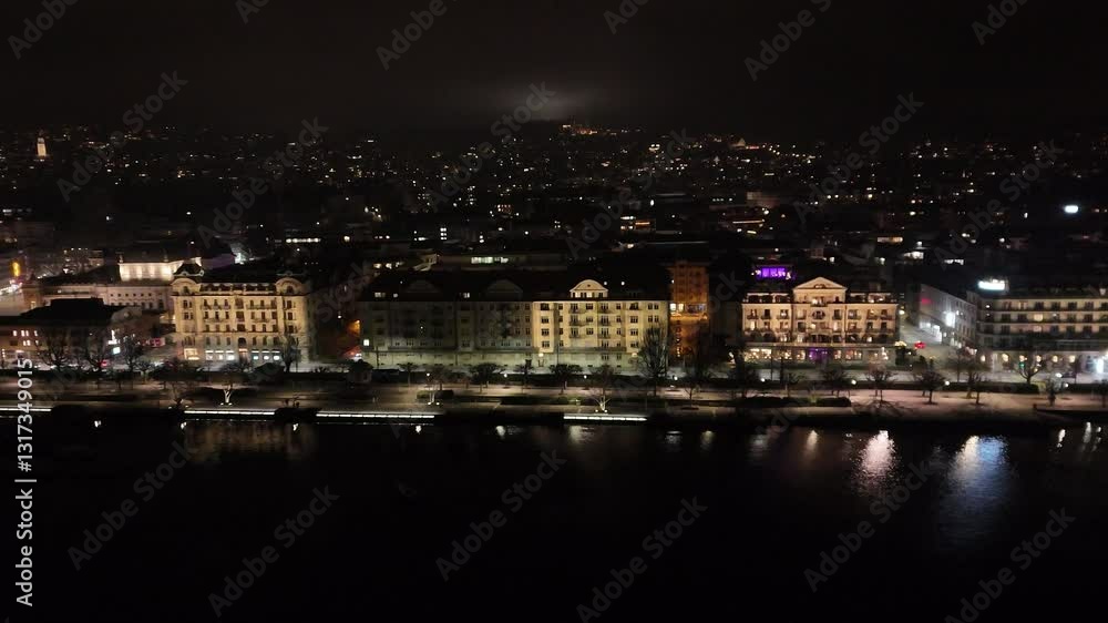 moving zurich's lakeside area night apartments offices illuminated roads cars driving part cityscape dynamic forward drone shot switzerland lake zurich urban lifestyle moving zurich's lakeside area night apartments offices illuminated roads cars driving part cityscape dynamic forward drone shot switzerland lake zurich urban lifestyle