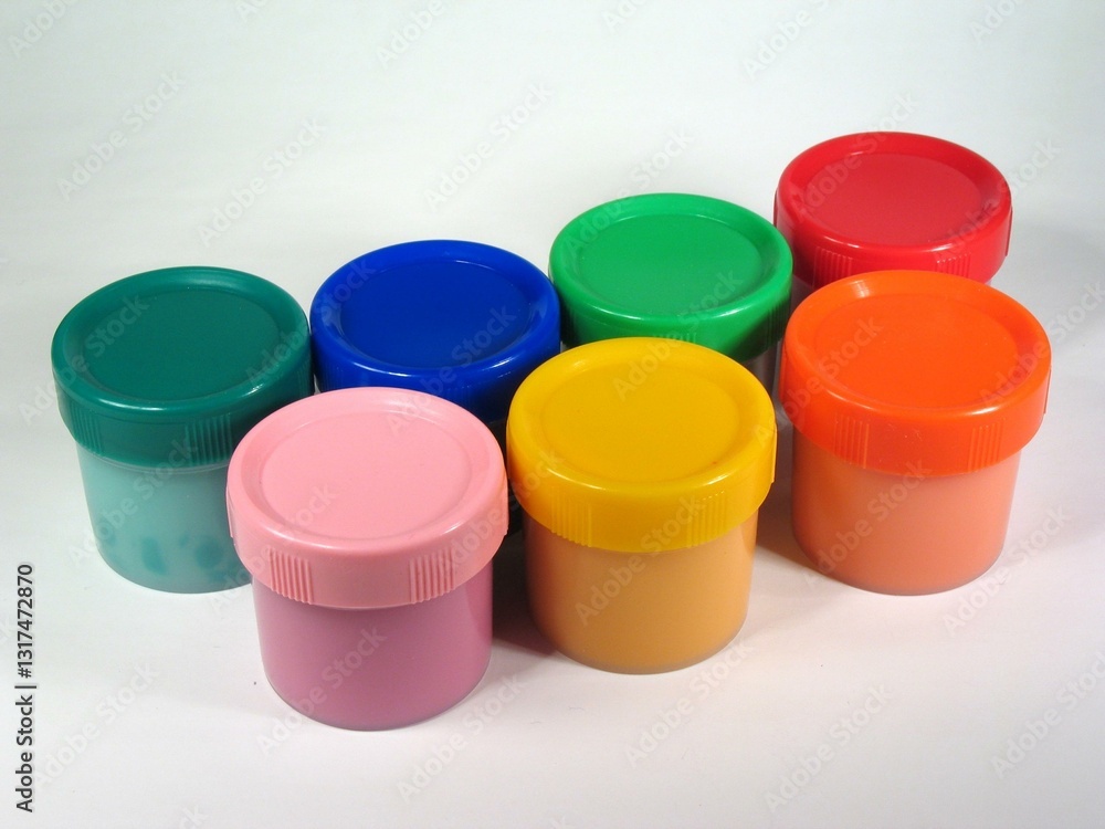 Colored paint cans over white background Colored paint cans over white background