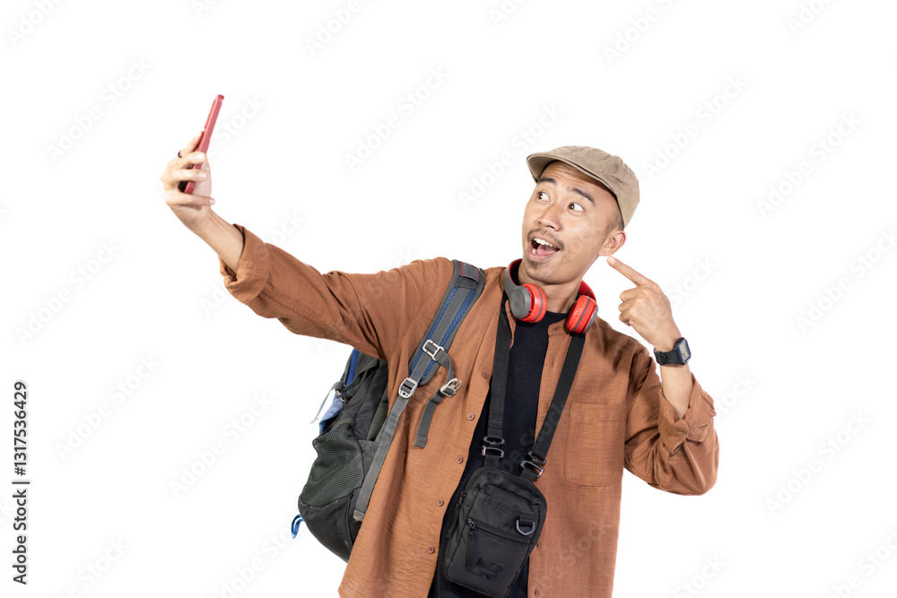 young indonesian male traveler taking selfie while traveling, travel concept, isolated on white background. young indonesian male traveler taking selfie while traveling, travel concept, isolated on white background.