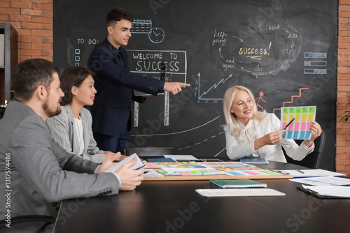 Colleagues working on busin...