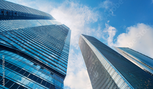 Wallpaper Mural View of high rise glass office building. Royalty high-quality free best stock of looking Up modern high-rise office buildings with blue sky in the background, Bottom up view reflective skyscraper mode Torontodigital.ca