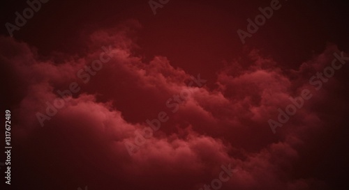 Bright red clouds in a dark sky.
