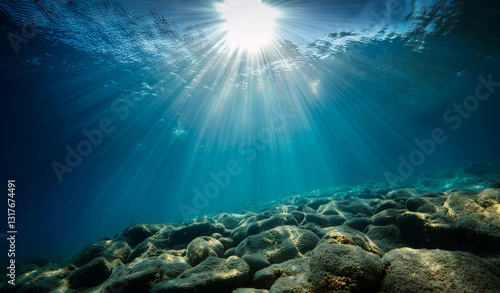 Wallpaper Mural Tranquil underwater scene with sun rays and clear blue ocean. Royalty high-quality free best stock of Underwater scene with rays of light shining down on the ocean, abstract background Torontodigital.ca