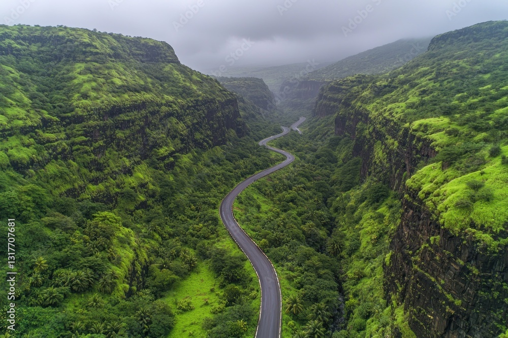 Winding road through lush green hills under an overcast sky Winding road through lush green hills under an overcast sky