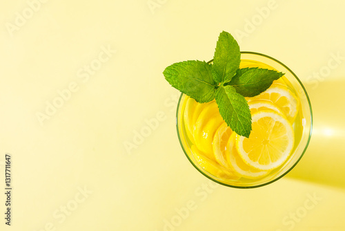 Obraz na płótnie Glass of lemonade with mint against yellow background. w salonie