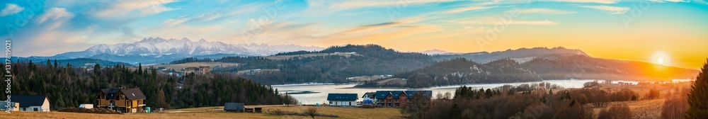 Beautiful panorama of Czorsztyn Lake at sunset. Castle in Czorsztyn, Castle in Niedzica with Tatry mountains in the background. Pieniny range of Poland