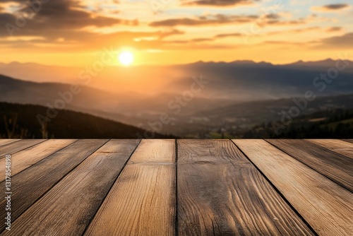 Wooden deck at sunset over mountains photo