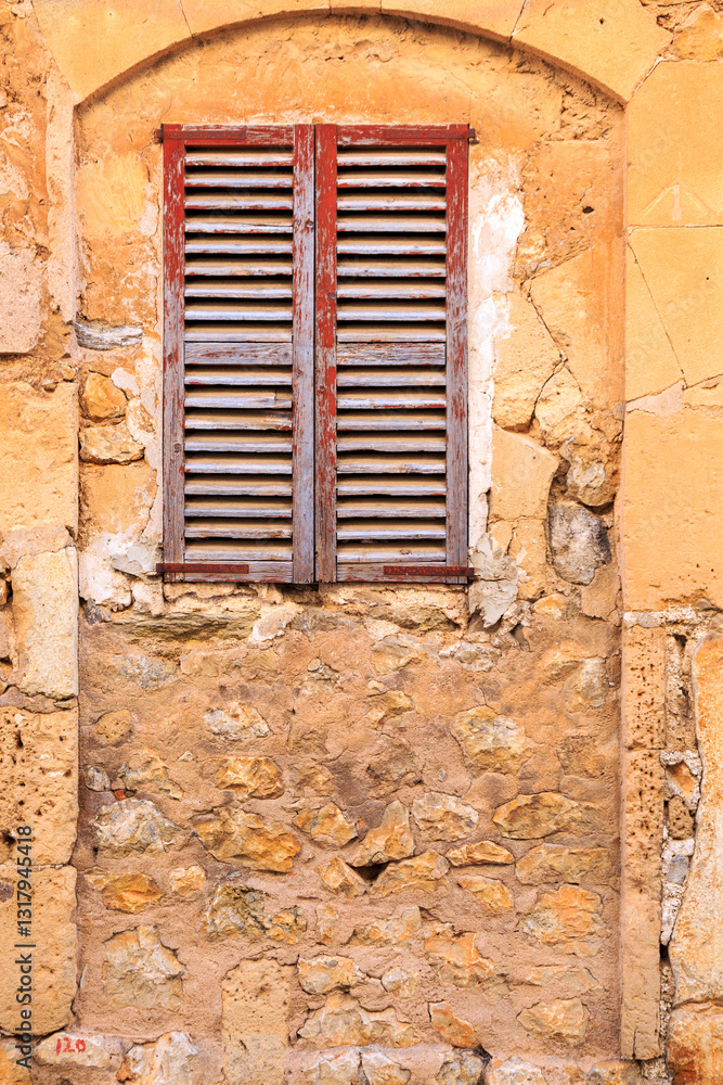 Europe, Spain, Balearic Islands, Mallorca. Wood shuttered window.