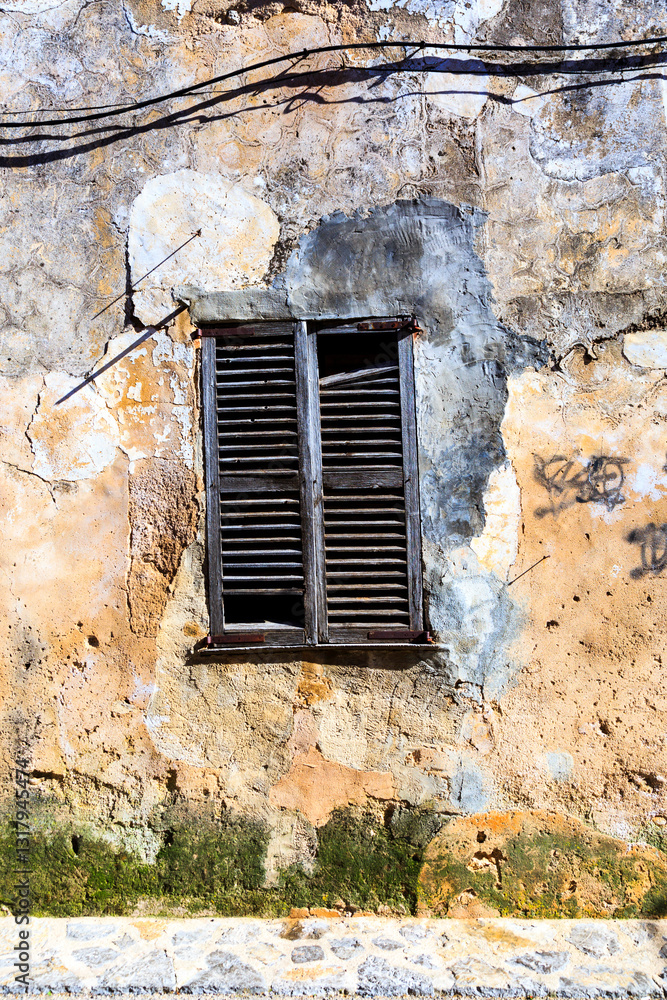 Europe, Spain, Balearic Islands, Mallorca. Wood shuttered window.