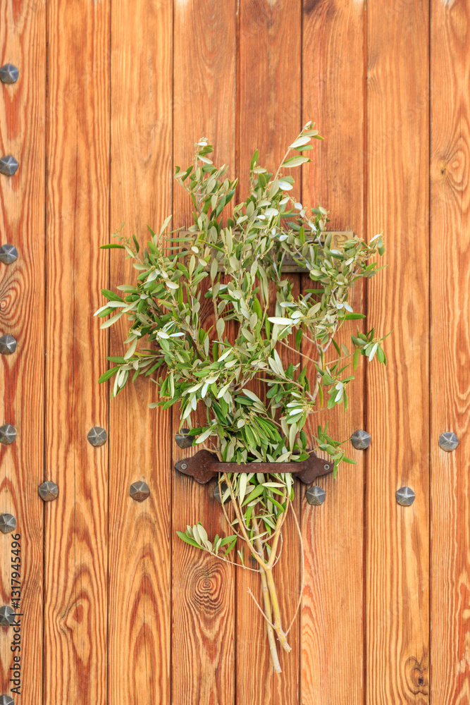 Europe, Spain, Balearic Islands, Mallorca. Olive branches on local doors during Easter celebration.