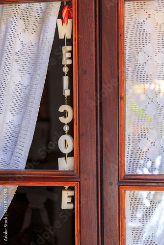 Europe, Spain, Balearic Islands, Mallorca. Welcome sign store window.