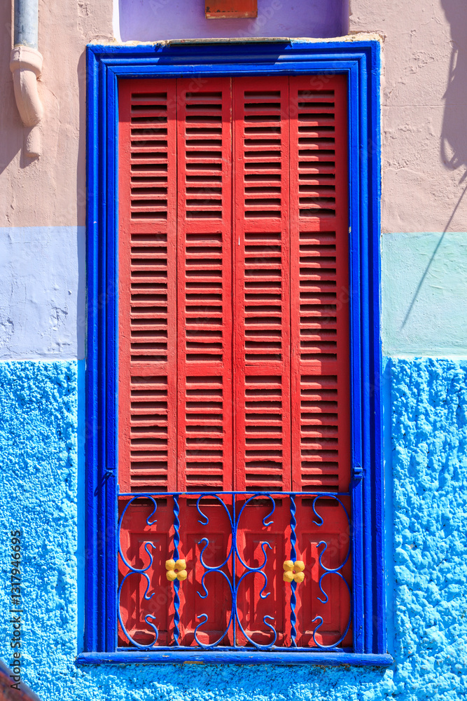 Mallorca, Spain. Palma. Red shutters and blue window.