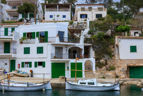 Europe, Spain, Balearic Islands, Mallorca, Santanyi, Cala Figuera . A small , colorful fishing harbor on S.E. corner of island. Sailboat anchoring. 2017-04-16