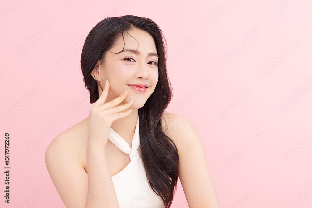 A beautiful young Asian woman with clean, fresh skin against a pink background. Skincare, facial treatment, cosmetology, beauty, and spa. An elegant portrait of an Asian woman. A beautiful young Asian woman with clean, fresh skin against a pink background. Skincare, facial treatment, cosmetology, beauty, and spa. An elegant portrait of an Asian woman.